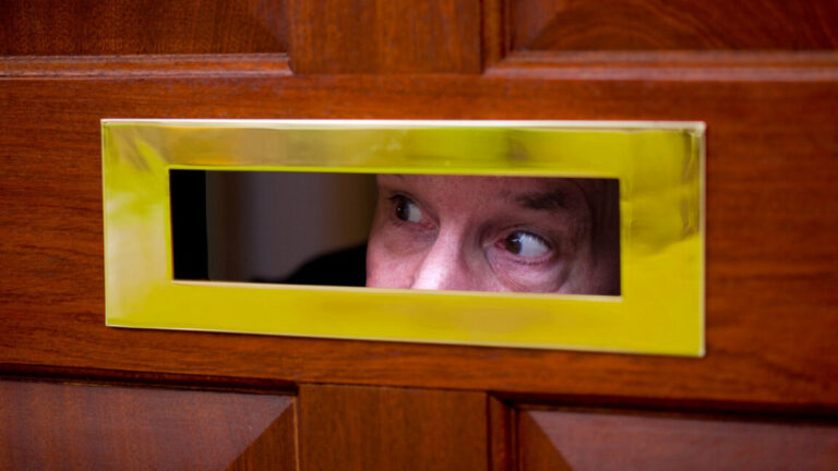 peeping through door slot 1152x648